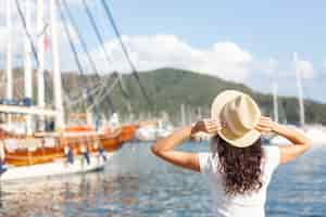 Free photo young woman standing on port