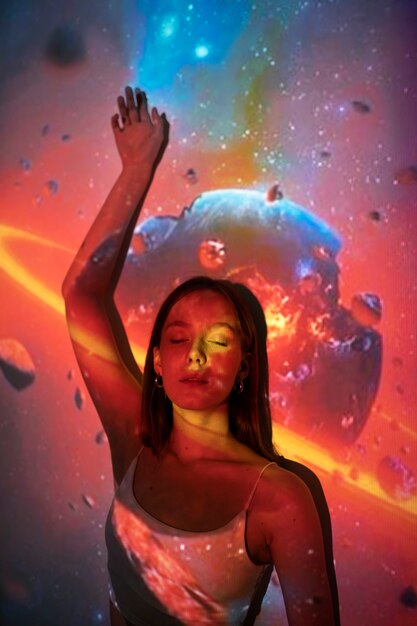 Young woman standing in universe texture projection