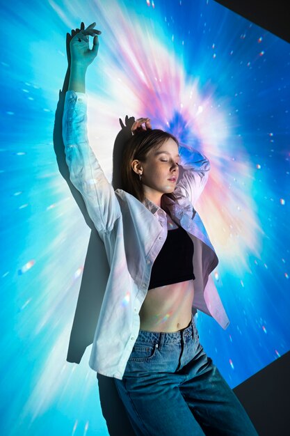 Young woman standing in universe texture projection