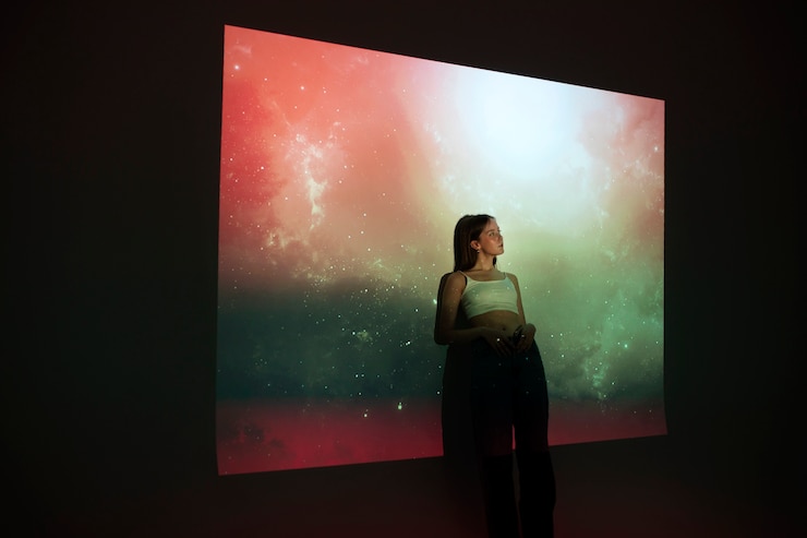 Free Photo young woman standing in universe texture projection