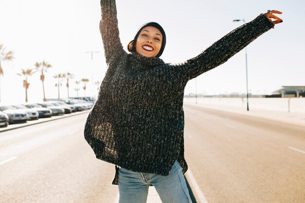 Young woman stretching arms