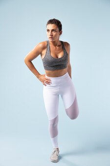 Young woman stretching before workout