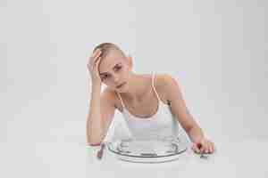 Free photo young woman struggling with an eating disorder