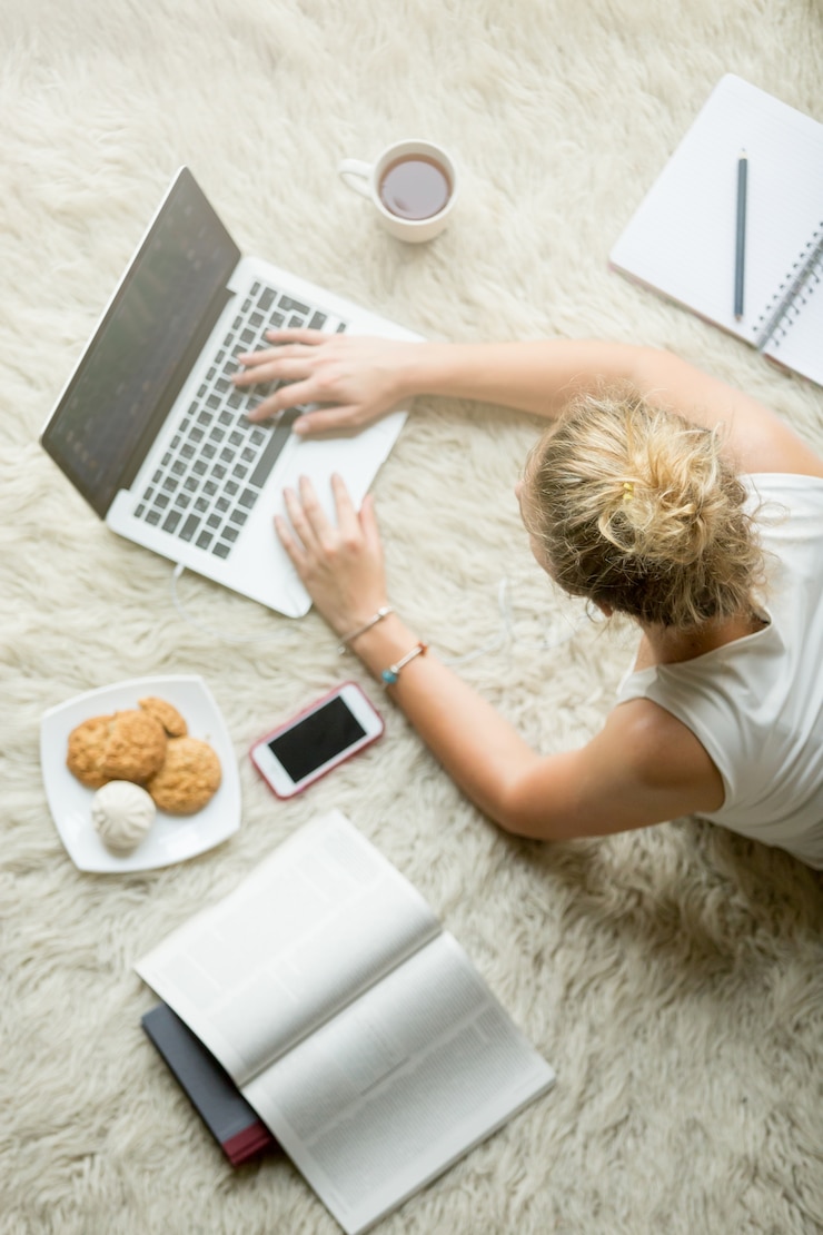 Free Photo young woman studying using technology