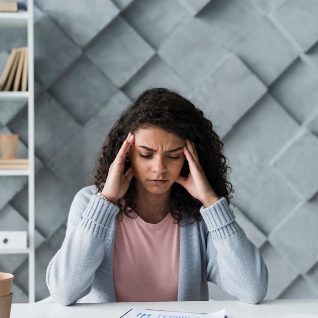 Young woman suffering from headache