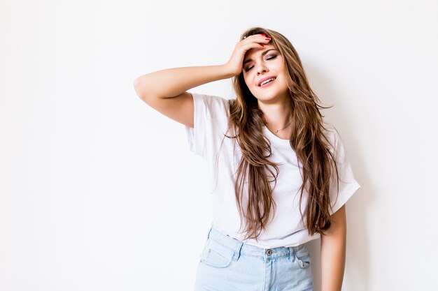 Young woman suffering of the pain over white background