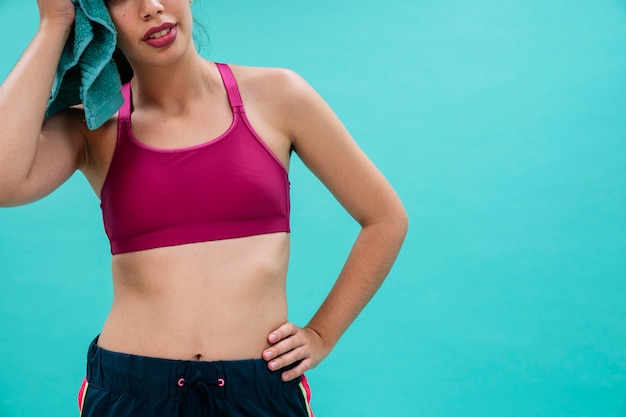 Young woman sweating and posing