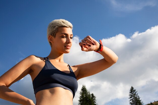 Young woman taking a break from running