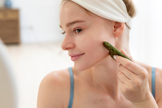 Young woman taking care of her face