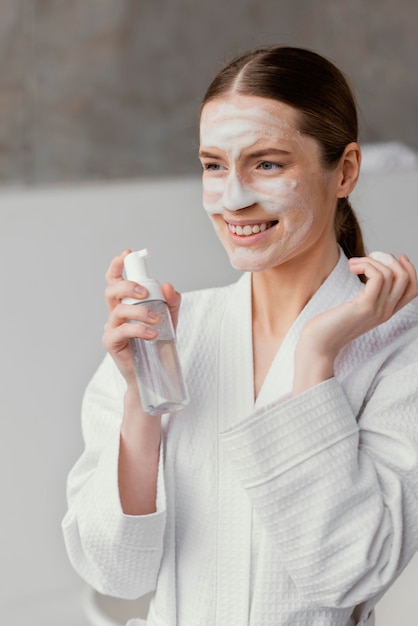 Free photo young woman taking care of herself at home