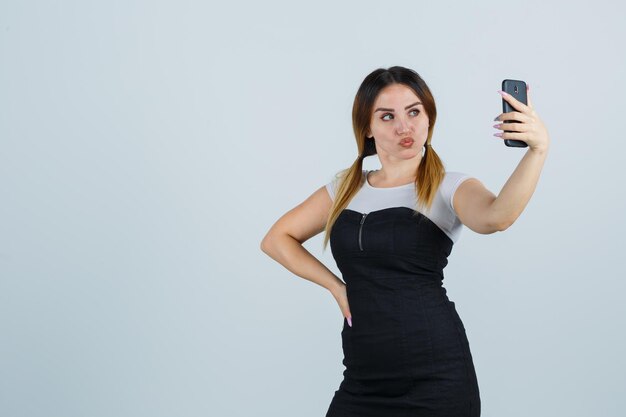 Young woman taking selfie