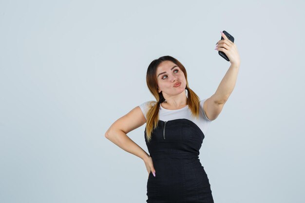 Young woman taking selfie