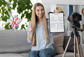 Free photo young woman teaching kids in english class online