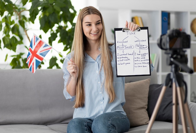 Young woman teaching kids in english class online