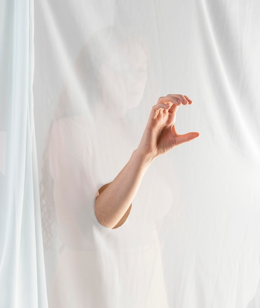 Free photo young woman teaching sign language