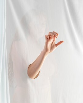 Young woman teaching sign language