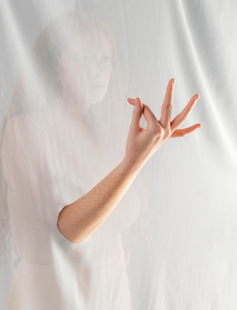 Young woman teaching sign language