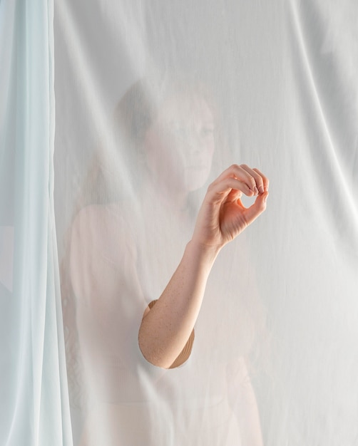 Free photo young woman teaching sign language