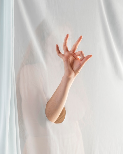 Young woman teaching sign language