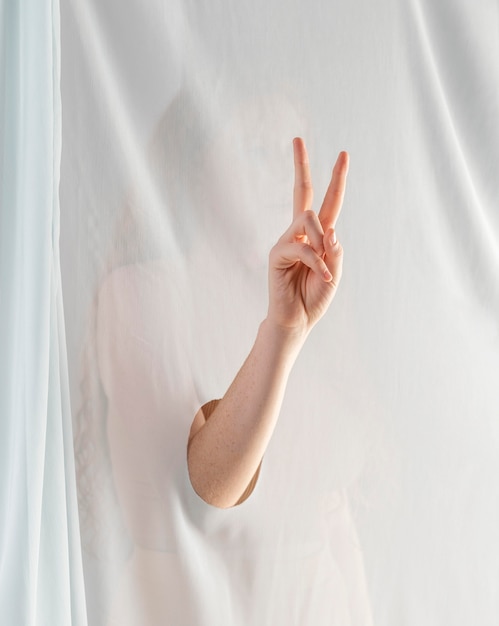 Young woman teaching sign language