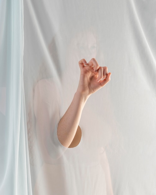 Young woman teaching sign language