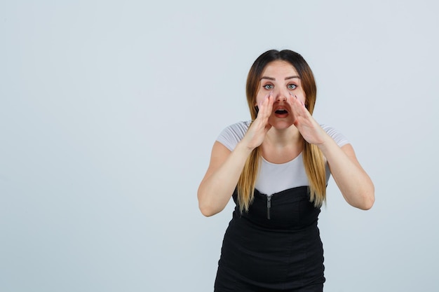 Young woman telling a secret