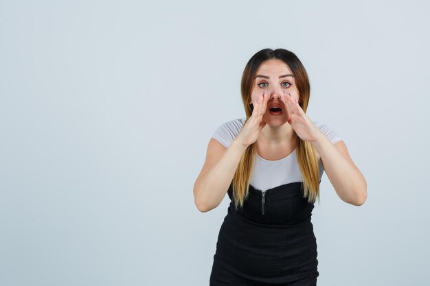 Young woman telling a secret