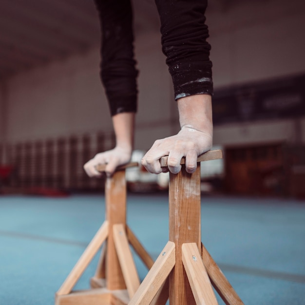 Free photo young woman training on wooden pieces