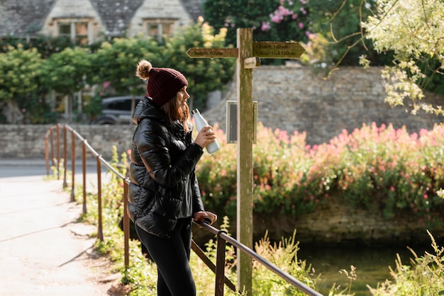 Free photo young woman traveling alone by foot