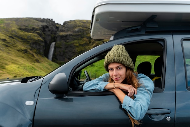 Free photo young woman traveling in country side