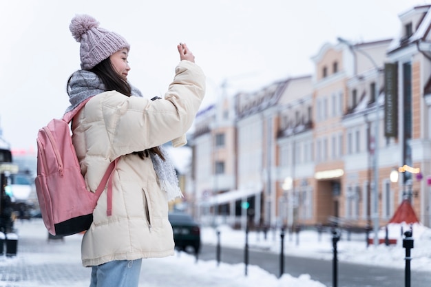 Free photo young woman traveling trough the city