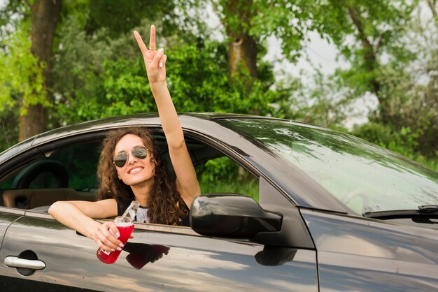 Young woman on a trip in a car