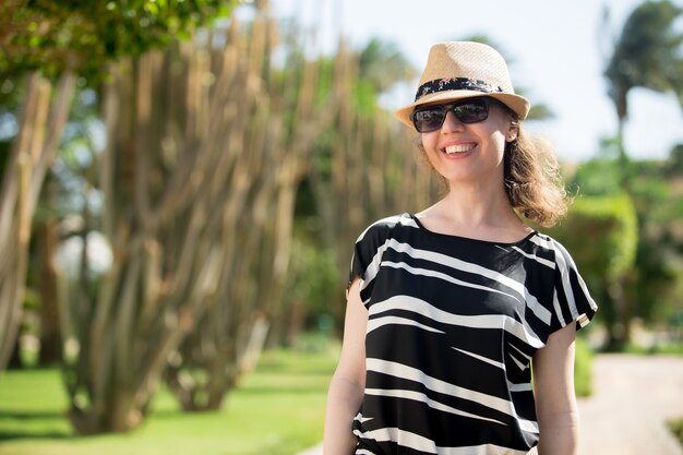 Young woman in tropical park