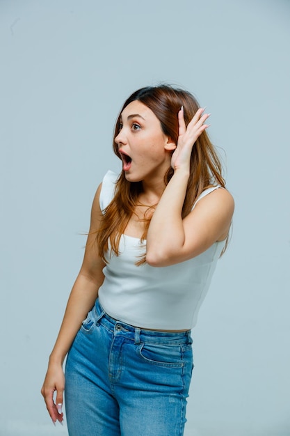 Free photo young woman trying to hear