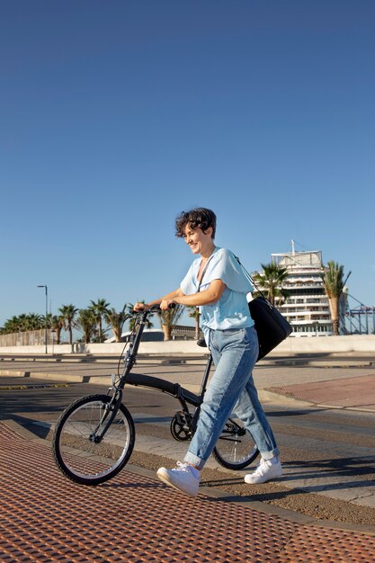 Young woman using her folding bike