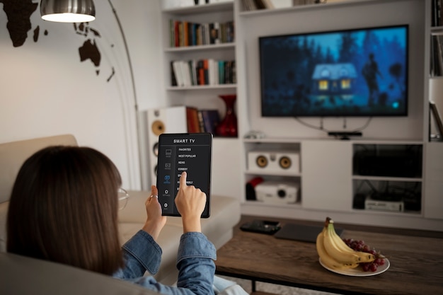 Young woman using home technology