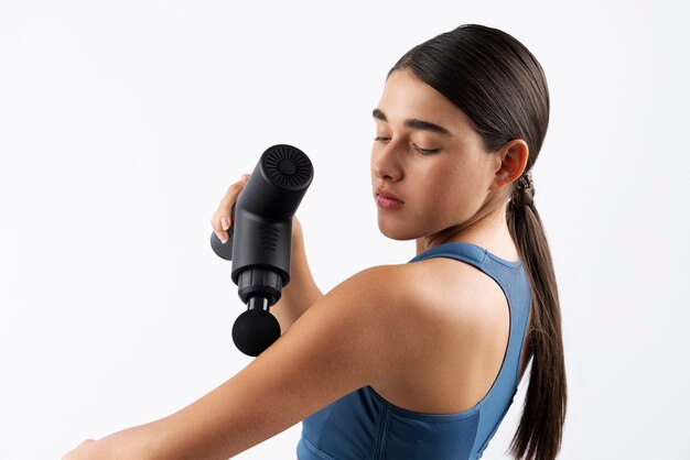 Young woman using message gun