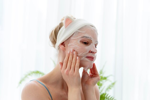 Young woman using a selfcare face mask