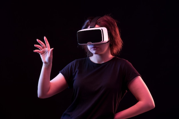 Young woman using VR glasses