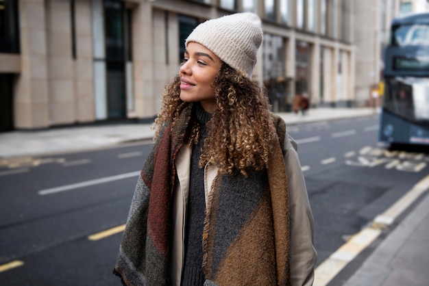 Free photo young woman walking in the city