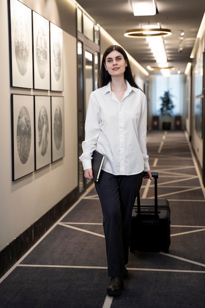 Young woman walking to her hotel room