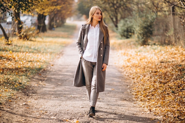 Young woman walking in park