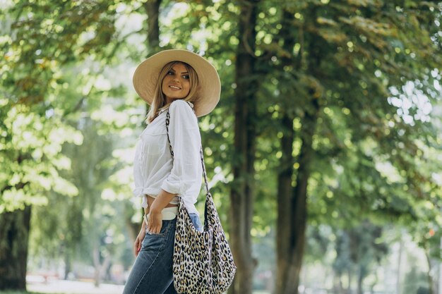 Young woman walking in park