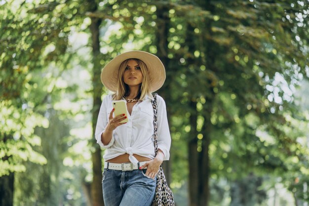 Young woman walking in park