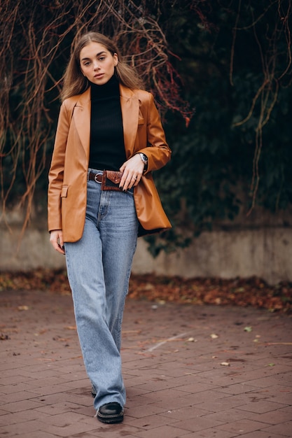 Young woman walking in park