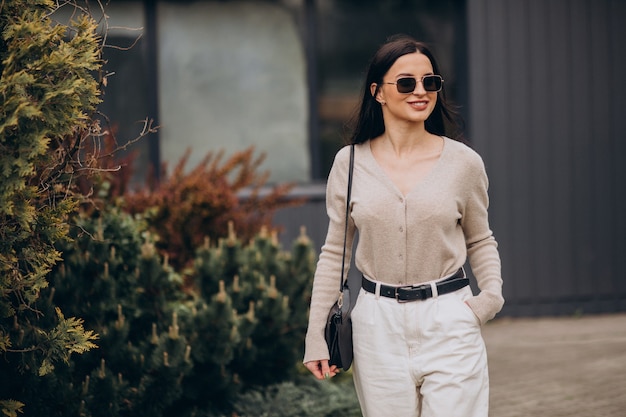 Young woman walking in the street