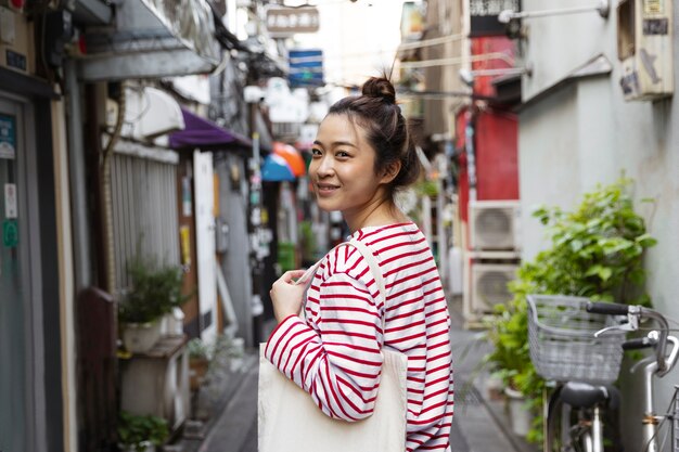 Young woman walking through the neighborhood