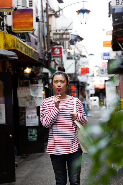 Young woman walking through the neighborhood