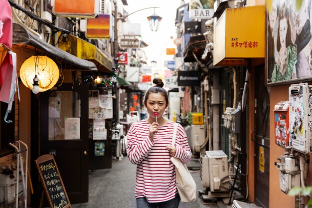 Young woman walking through the neighborhood