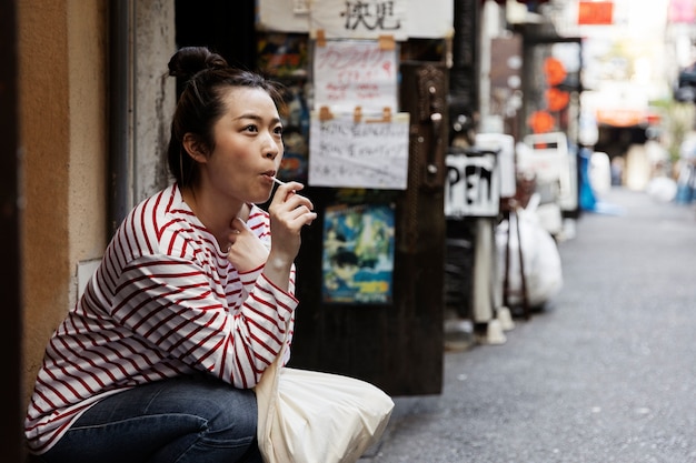 Young woman walking through the neighborhood